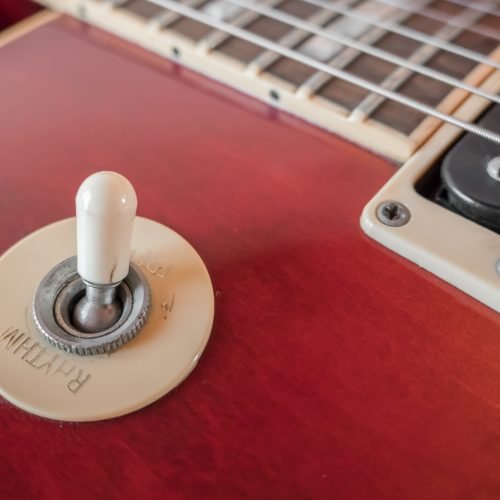 Rhythm and Treble mode pickup selector switch. Close - up of pickup selector switch on a vintage electric guitar.